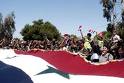 Hundreds of Thousands of Syrians Raise 2,300 Meter Long Syrian Flag