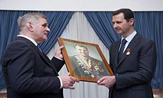 Al-Assad Visits Displaced Outside Capital: Russia Restoring Balance to World Stage