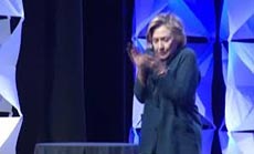 Woman Throws A Shoe at Hillary Clinton