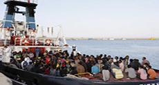 Italy Rescuing 3,000 Migrants, 18 Boats in Trouble

