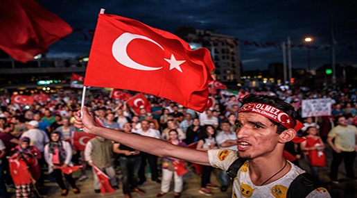 Turkish man holding a flag