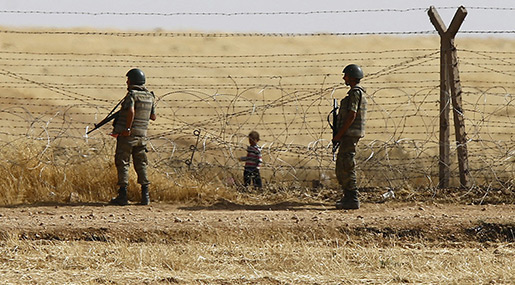 Turkish borderguards and a refugee