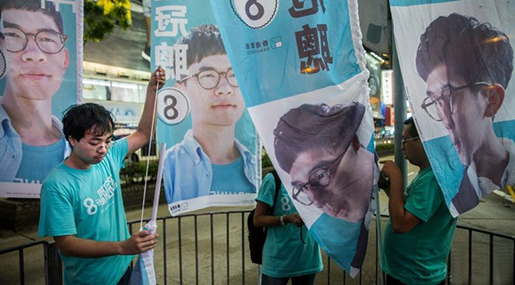 Supporters of Nathan Law put up flags in Causeway bay following his win in the Legislative Council election in Hong Kong on Sep 5, 2016