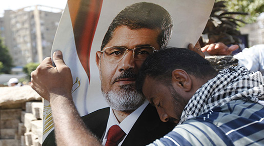 Mohammad Morsi supporter with poster of Morsi