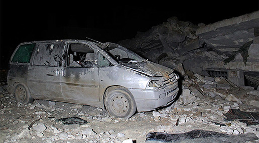 Shelled car next to destroyed mosque in the Syrian village