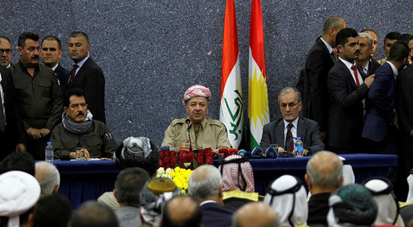 Iraqi Kurdish President Masoud Barzani sits with Kirkuk Governor Najmaldin Karim