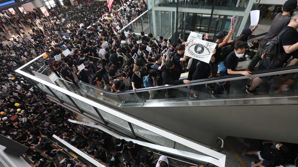 Hong Kong Airport Protesters Retreat, But City in Turmoil