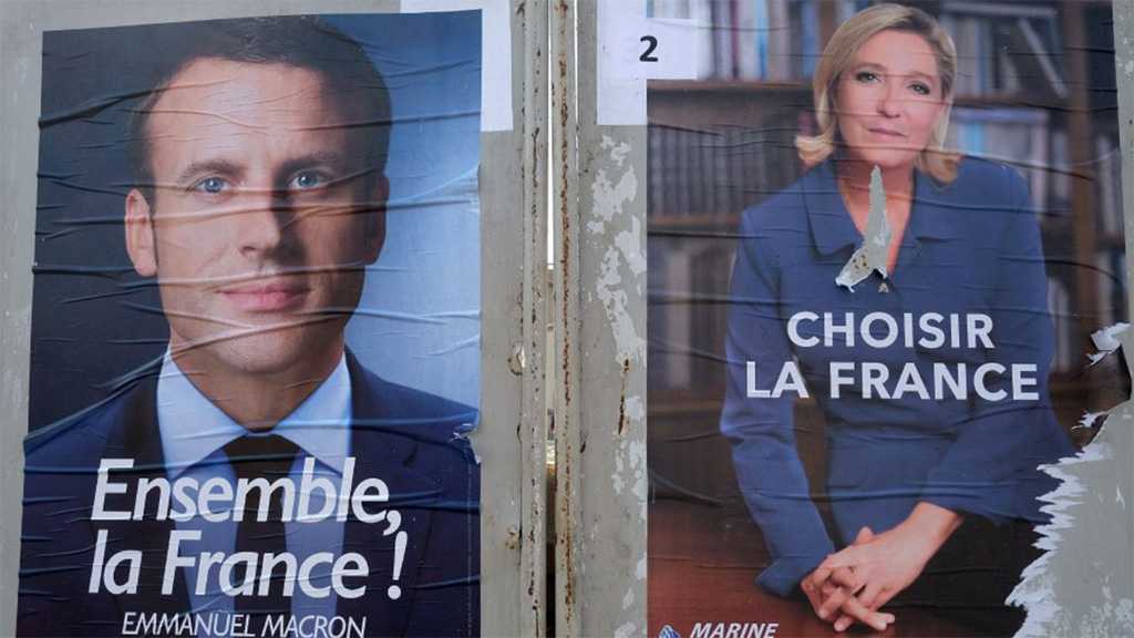 Macron and Le Pen Clash Over Russia, Hijabs in Fractious Debate