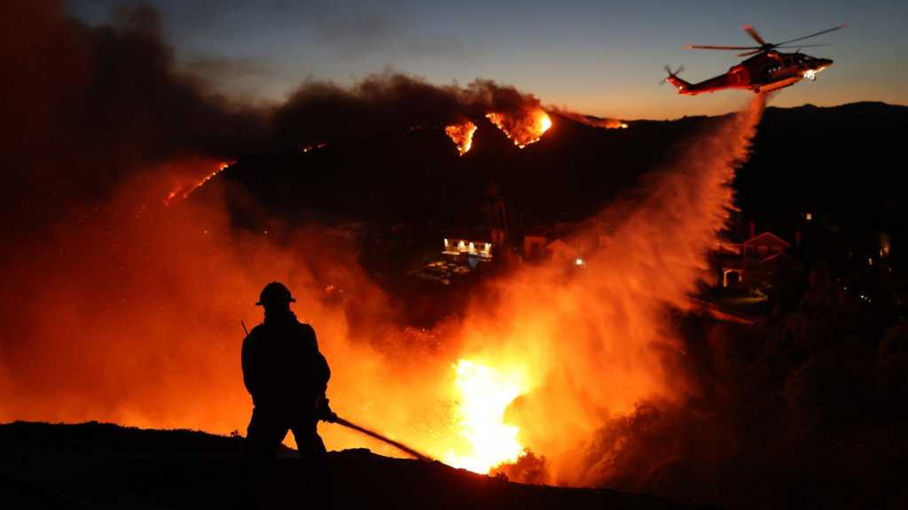 Los Angeles Braces for Strong Winds Threatening to Intensify Devouring Wildfires