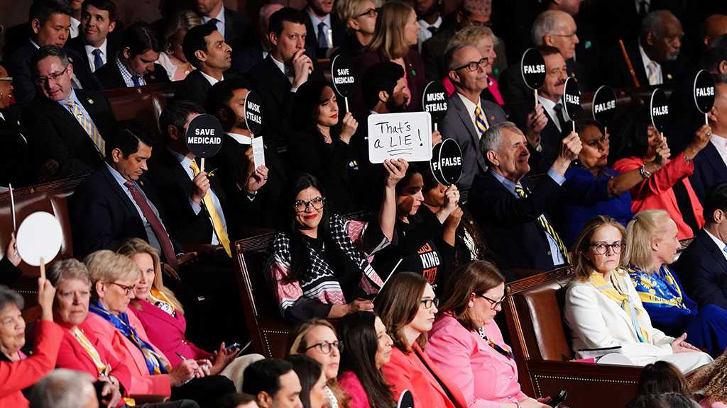 Democrats Disrupt Trump’s Congress Speech with Protests and Signs