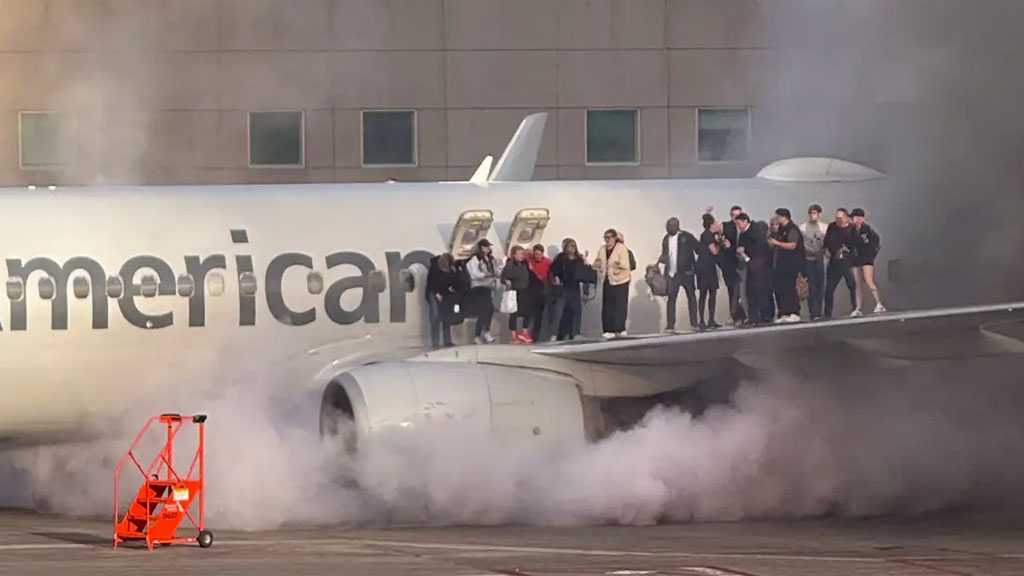 American Airlines Plane Catches Fire at Denver Airport, 12 Hospitalized